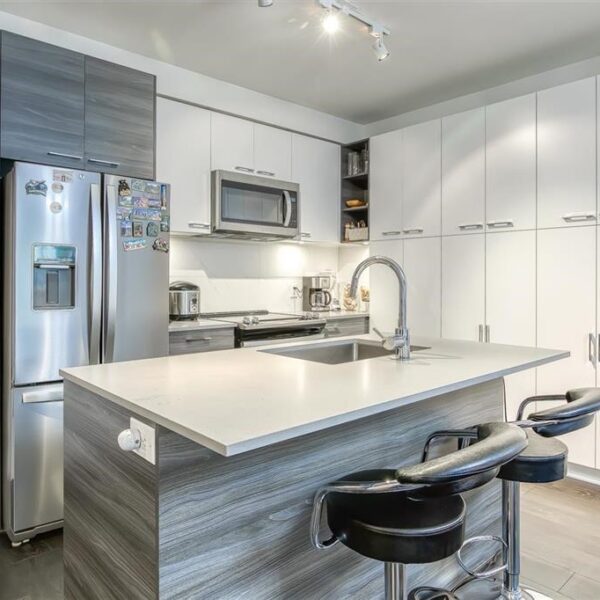 Extra Spacious Two Bedroom with Flex Area and Parking for Two Cars in Convenient Surrey Central